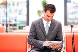 online-expense-reporting	|	Photo Courtesy of	Depositphotos	http://depositphotos.com/10422781/stock-photo-Businessman-using-tablet-at-airport.html?sst=0&sqc=9&sqm=493&sq=1iugtf 